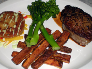 Seared Filet Mignon w/ pan jus, Crab Cakes w/ wasabi cream and Pepper Salad, Steak Fries and Steamed Broccolini.